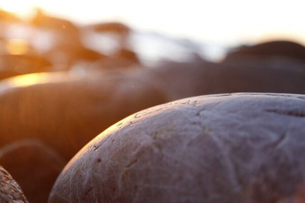 Beach stones and rocks closeup, sunset and sunrise