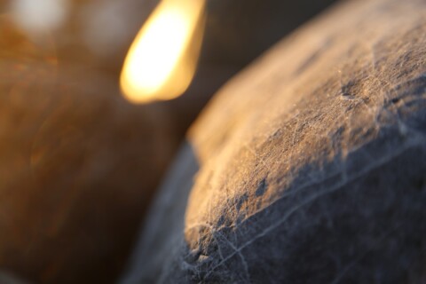 Beach stones and rocks closeup, sunset and sunrise