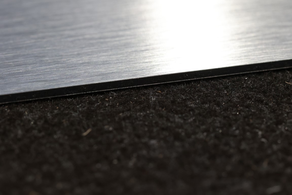 Photo of brushed aluminium sheet edge.